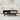 Black Mid Century Modern Wood Coffee Table with Sliding Linen Door Panel and Storage